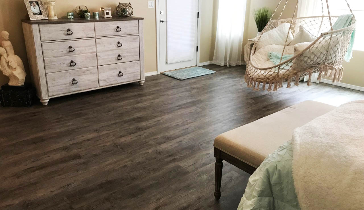 Photo of brown theme flooring in bedroom by Perfection Carpet & Flooring