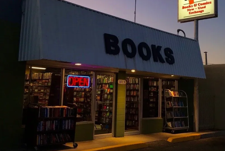 Don's Paperback Books photo of Don's Paperback Bookstore at night